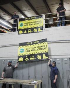 MPI employees hoisting the safety banner again nine years in a row