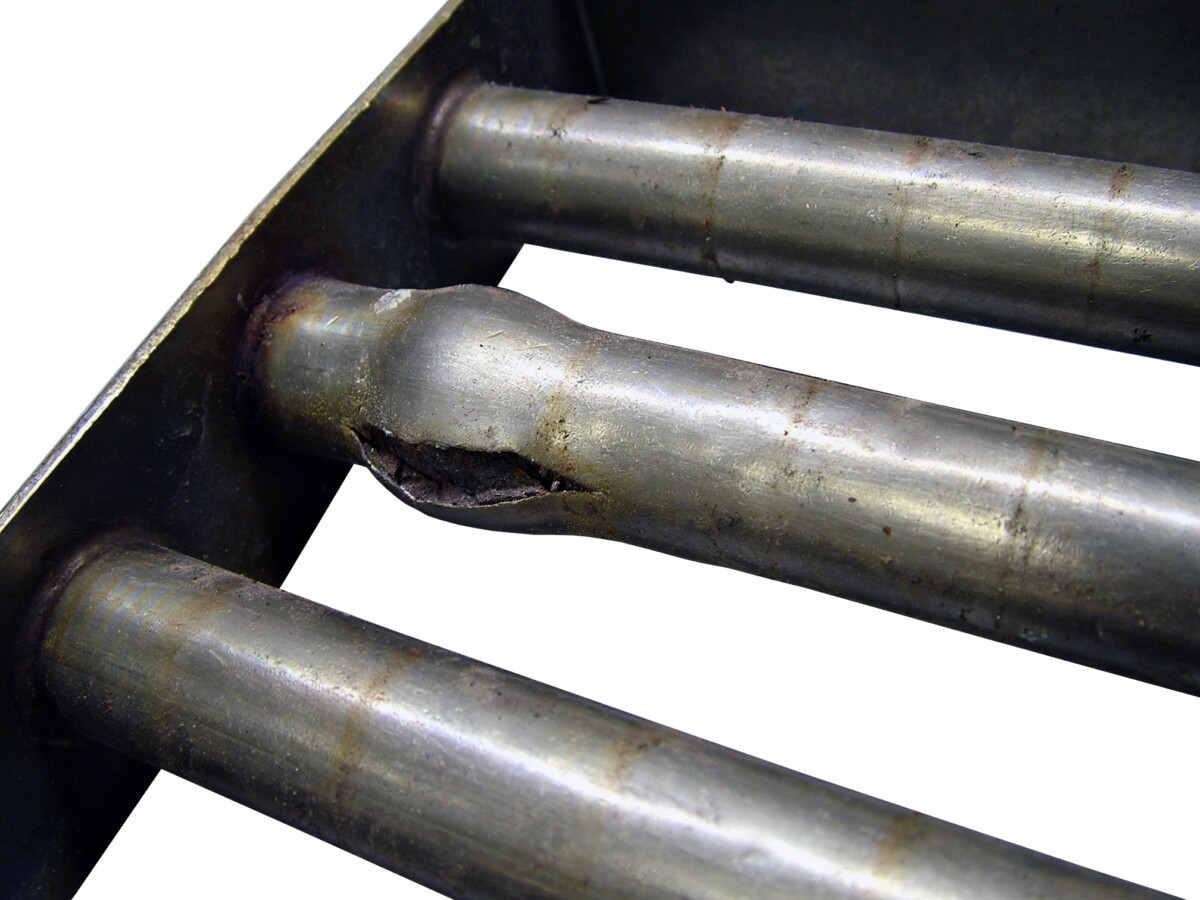 Magnetic grate showing damage to tube