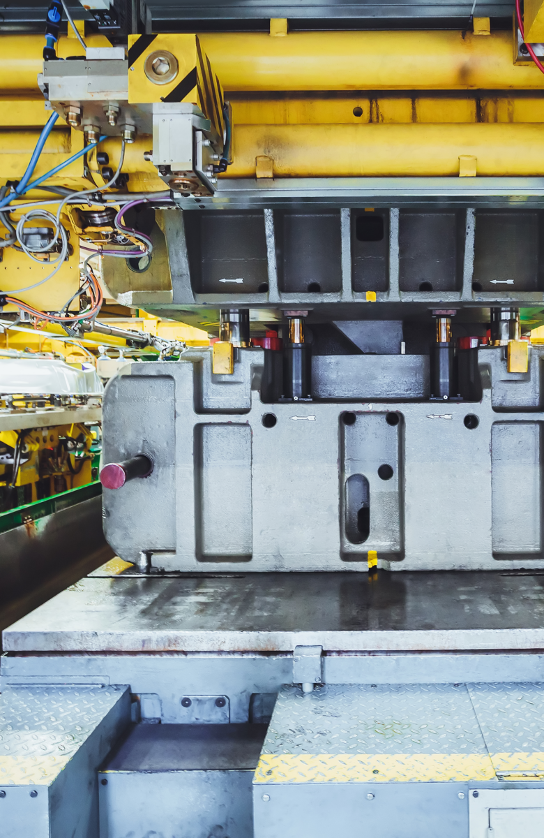 Metal stamping press in factory setting