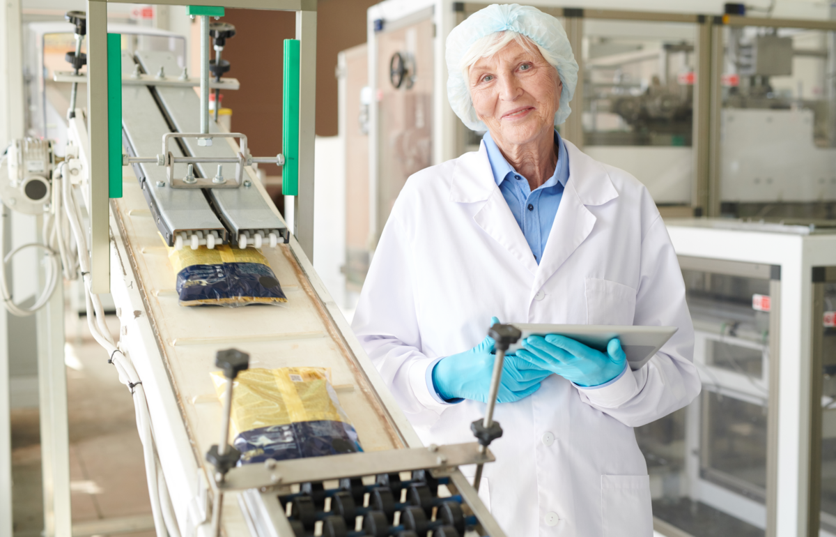 Female food safety officer in food processing facility