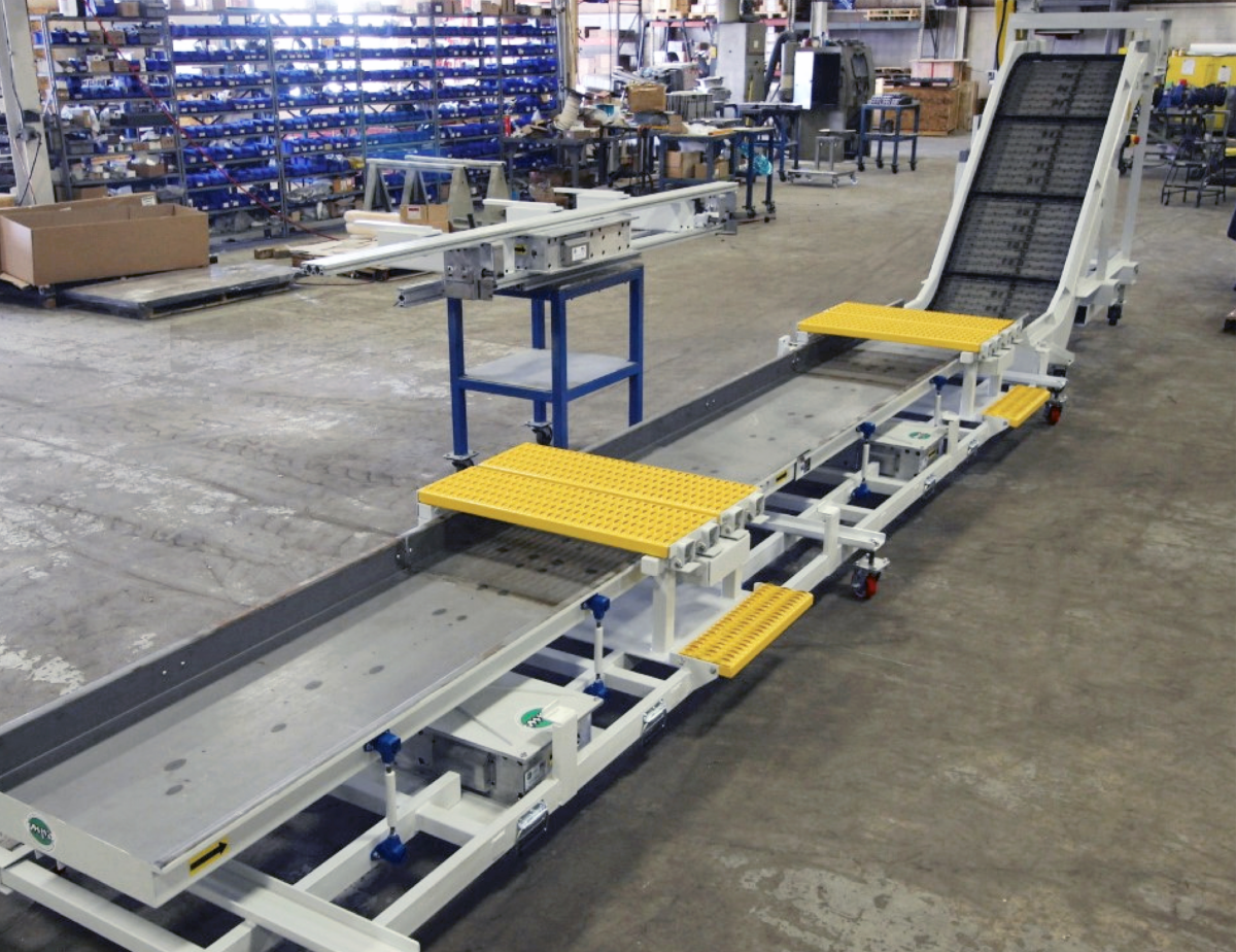 Multi product material handling solution with magnetic and steel hinge conveyors